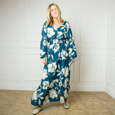 The teal blue Floral Print Maxi Dress with a v neckline and long sleeves elasticated at the cuff